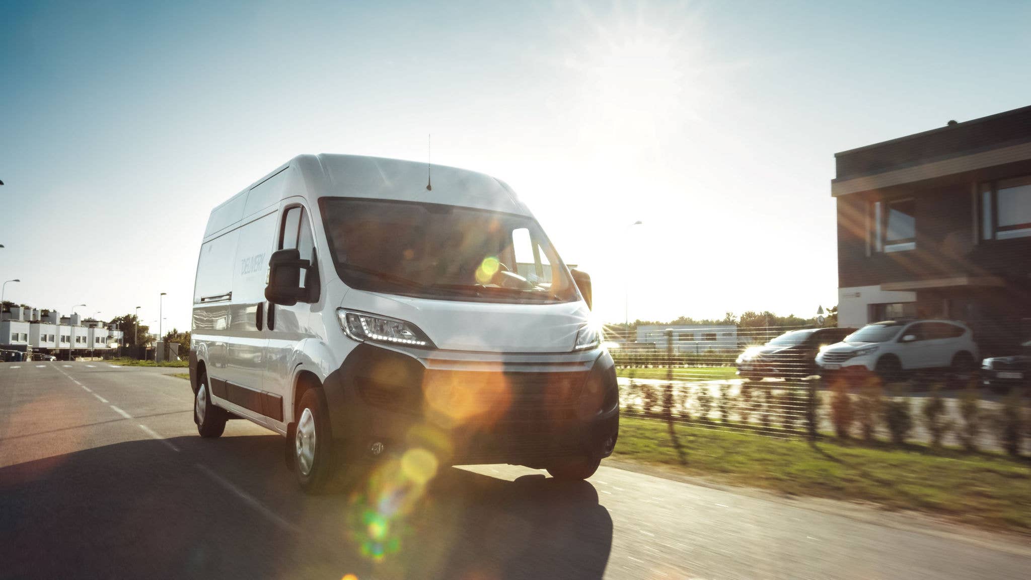   Commercial motor vehicle driving on the road.