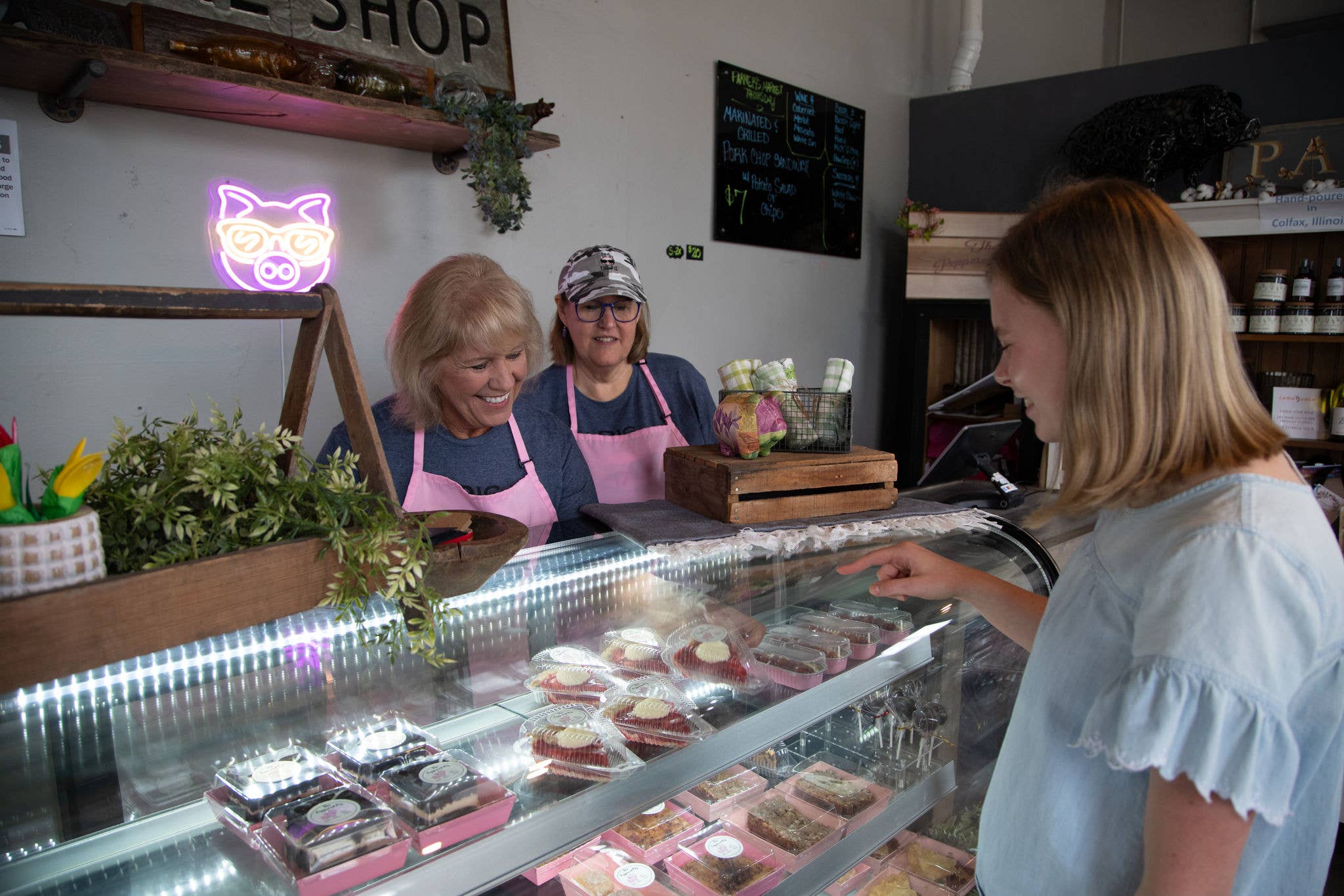 Customer picking out baked goods at a bakery