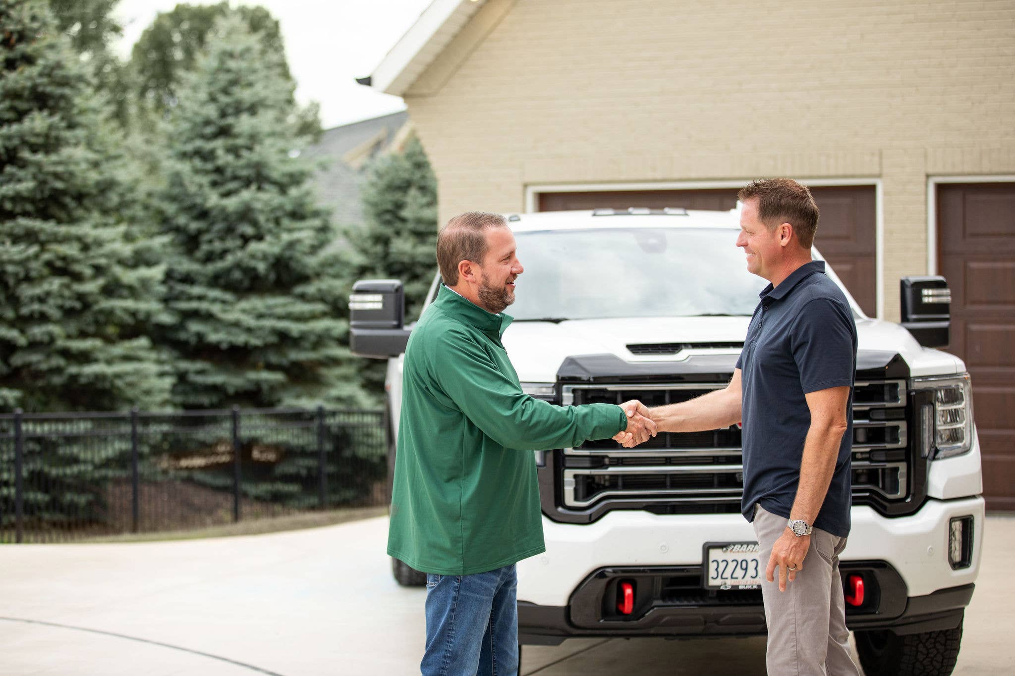 A COUNTRY Financial representative shaking hands with a client.