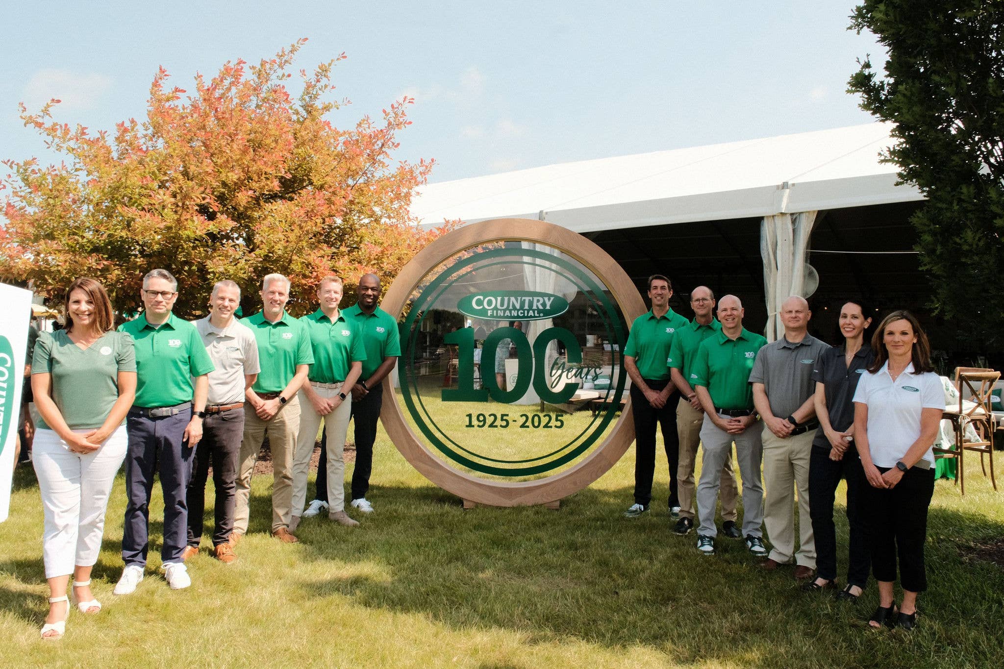 COUNTRY Financial Leadership Council with 100 Year Sign