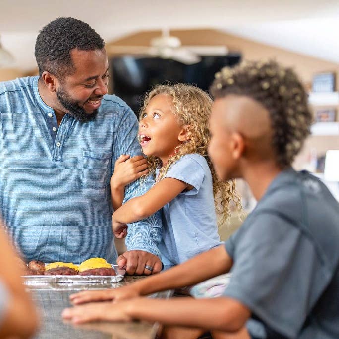 Family making dinner in kitchen
