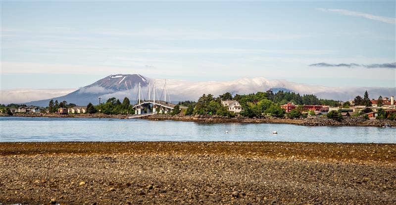Alaskan town with Volcano in background.