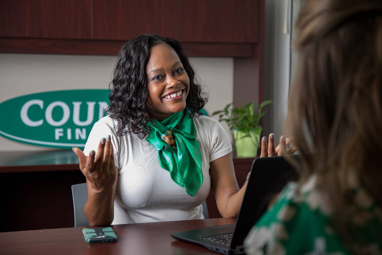Smiling female Country Financial Insurance agent