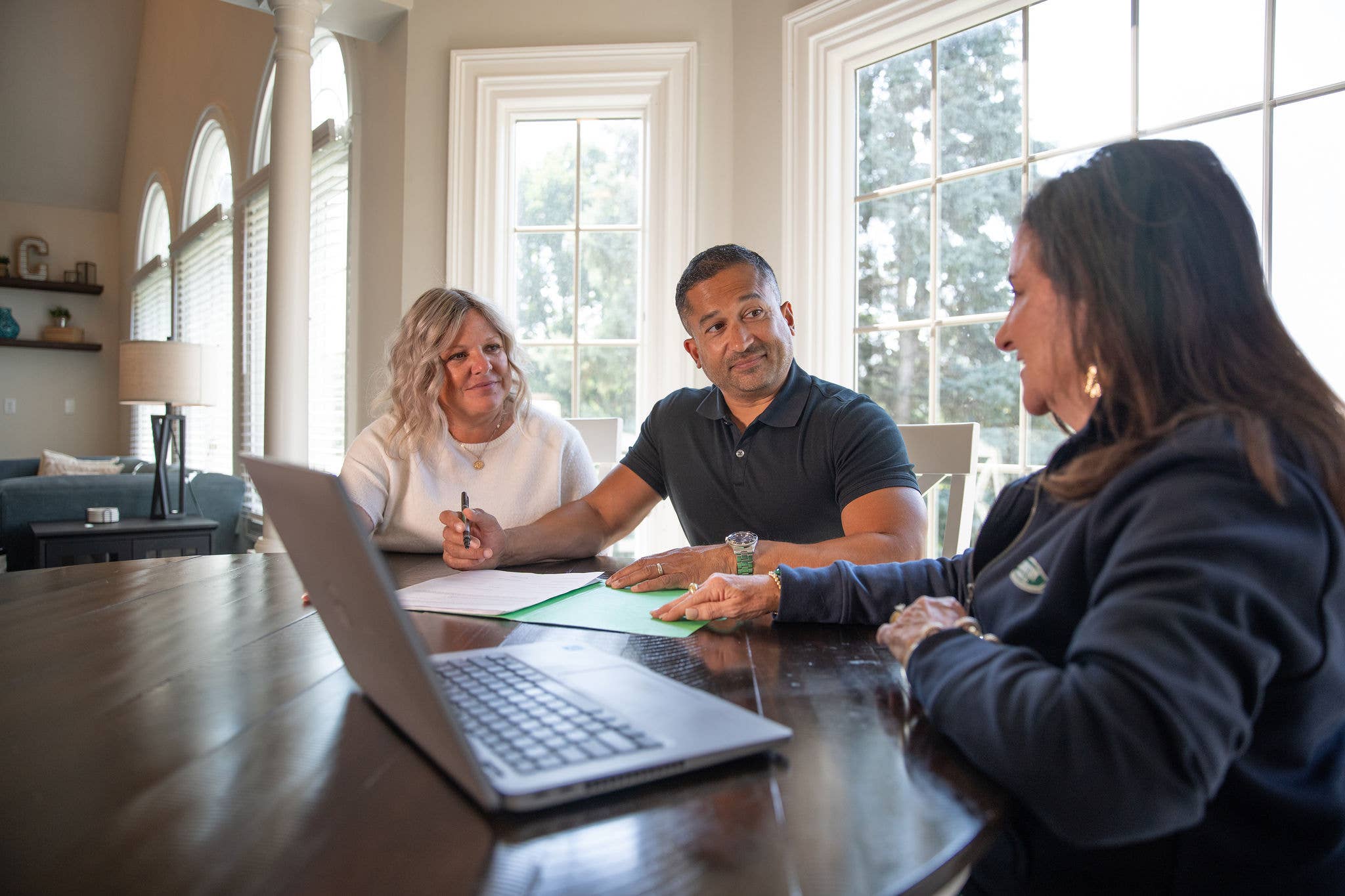 A COUNTRY Financial rep talking with her clients about insurance