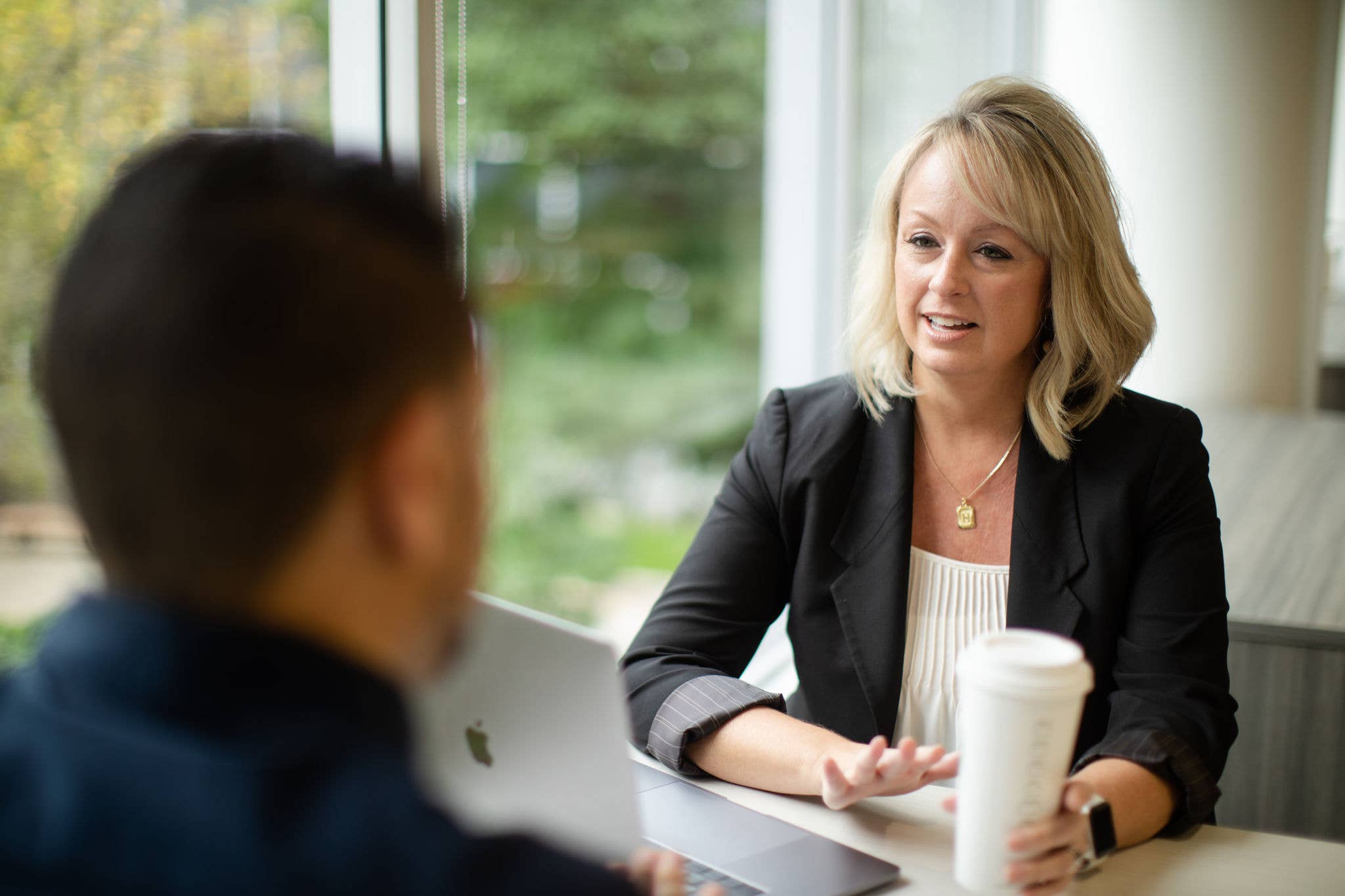 Two professionals engaged in an interview-style conversation