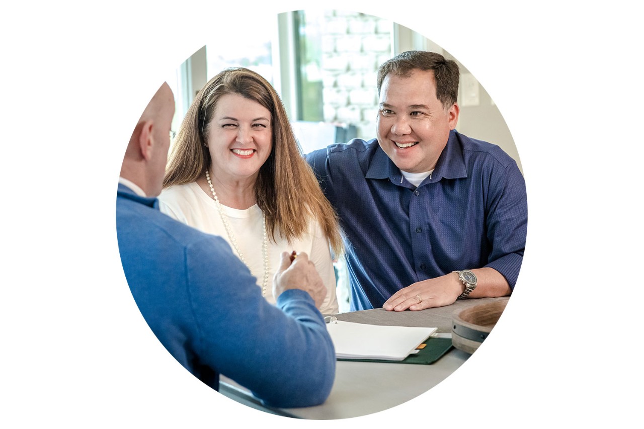 Couple meeting with agent at home