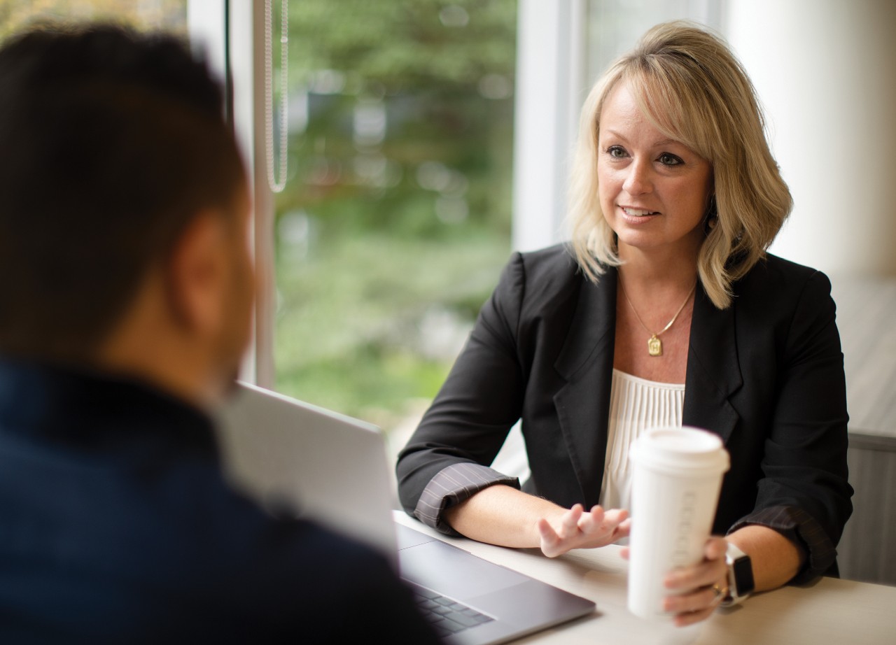 Rep meeting with client in office