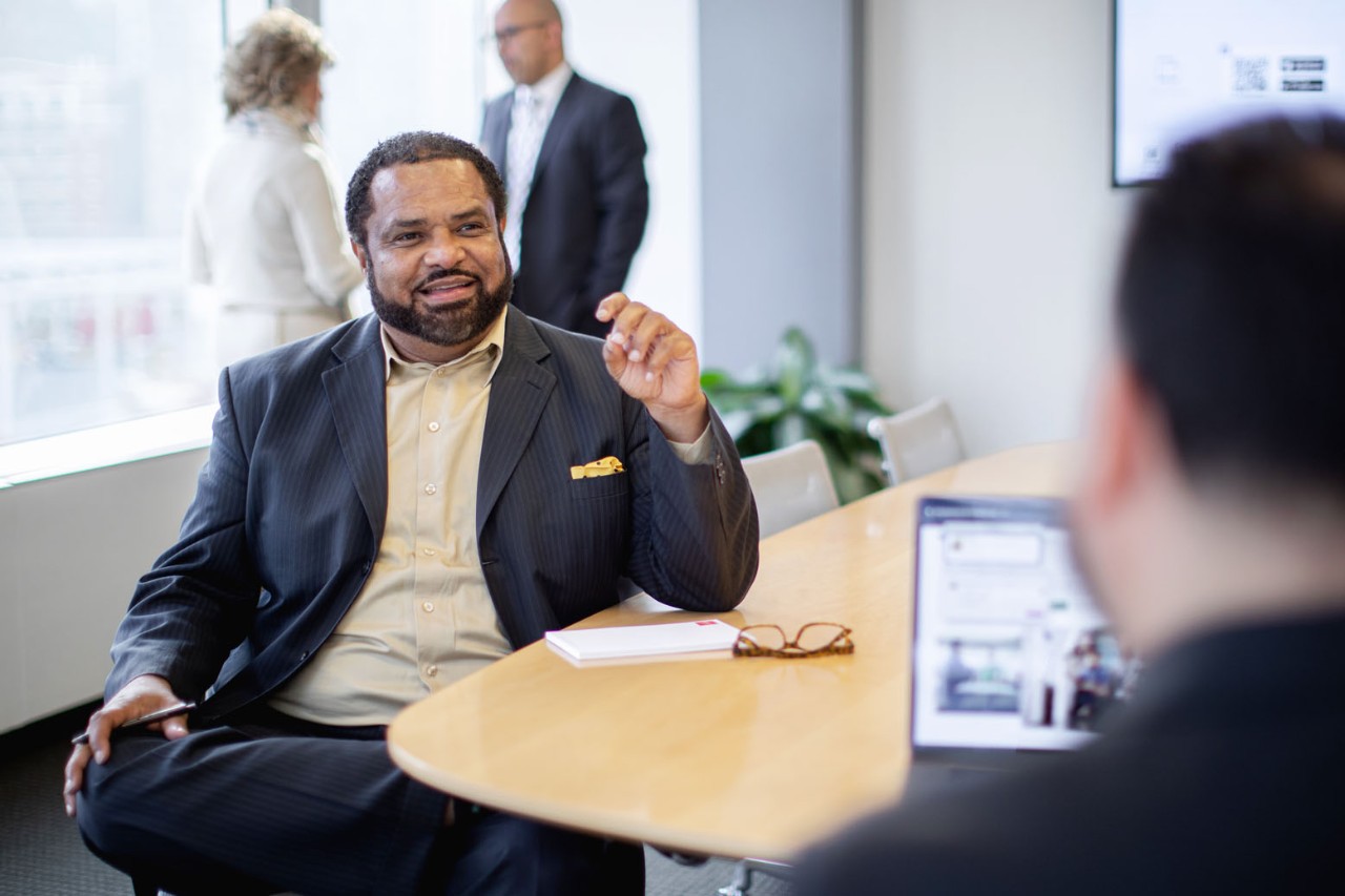 Rep having a discussion at a conference table