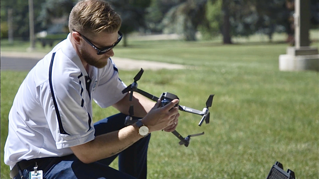 Claims agent setting up drone
