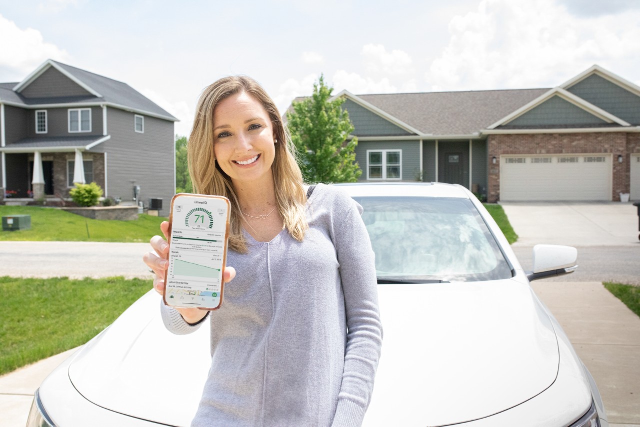 Woman with DriverIQ app