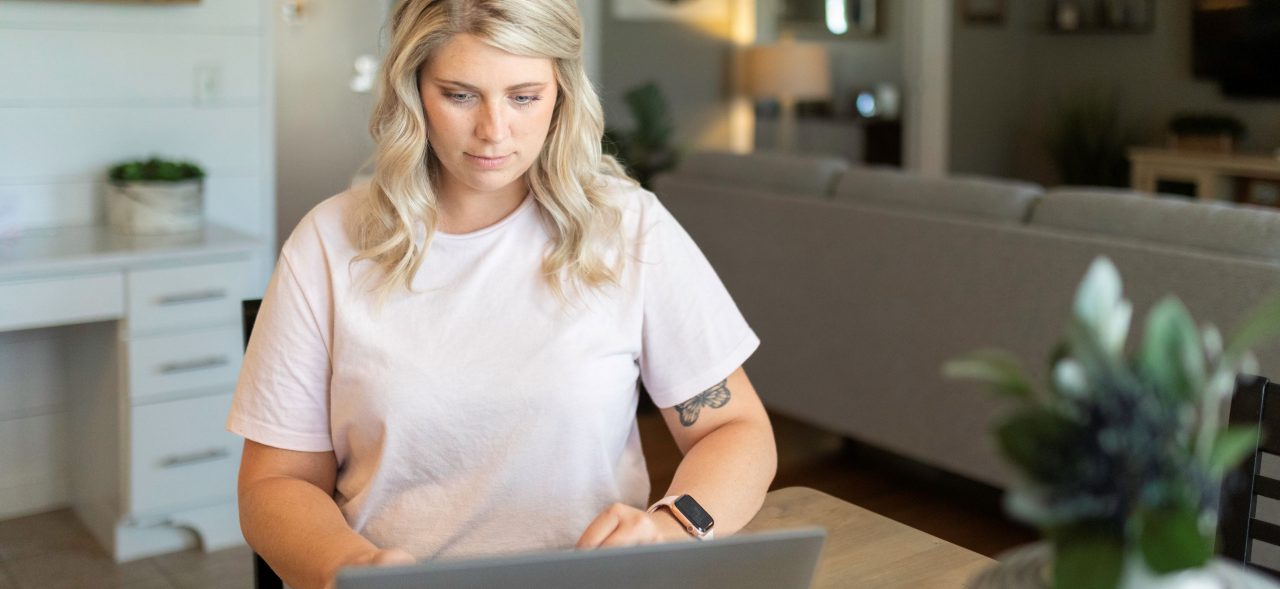 Woman on laptop in dinning room