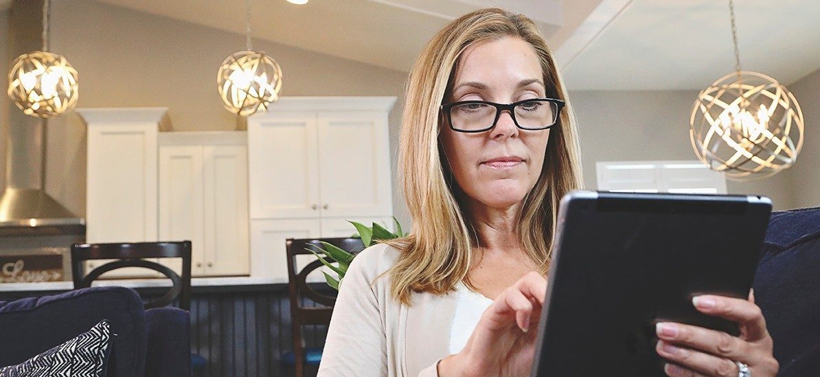 Woman with a tablet looking for insurance