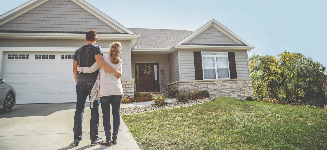 Young couple looking at home