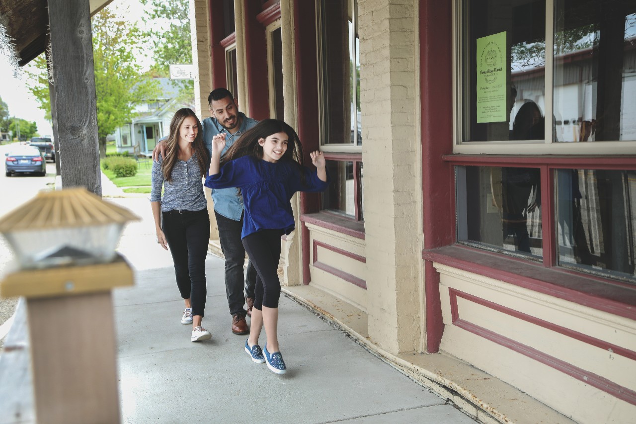 A young happy family walking to a restaurant