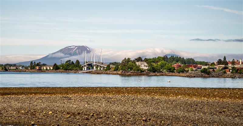 Alaskan town with Volcano in background.