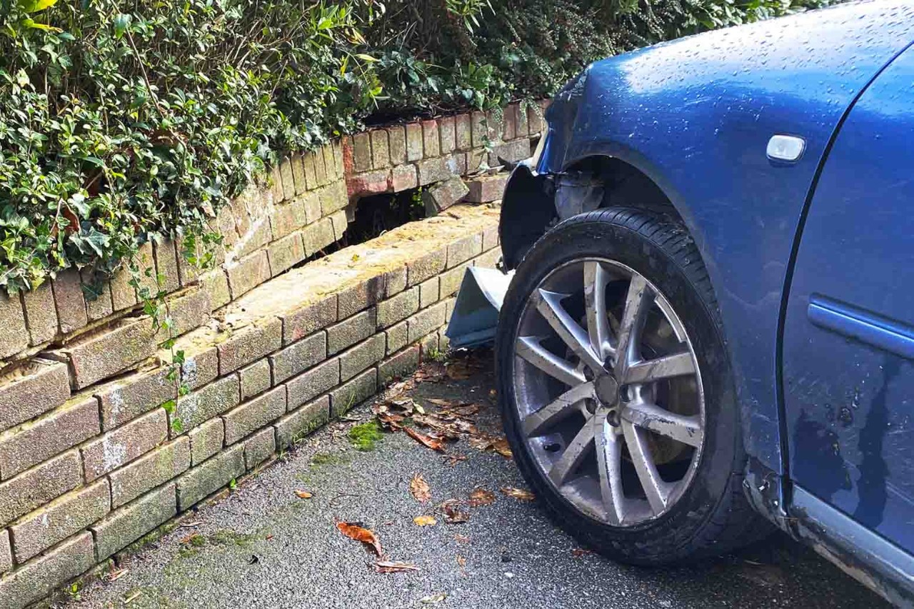 Car crashed into brick wall