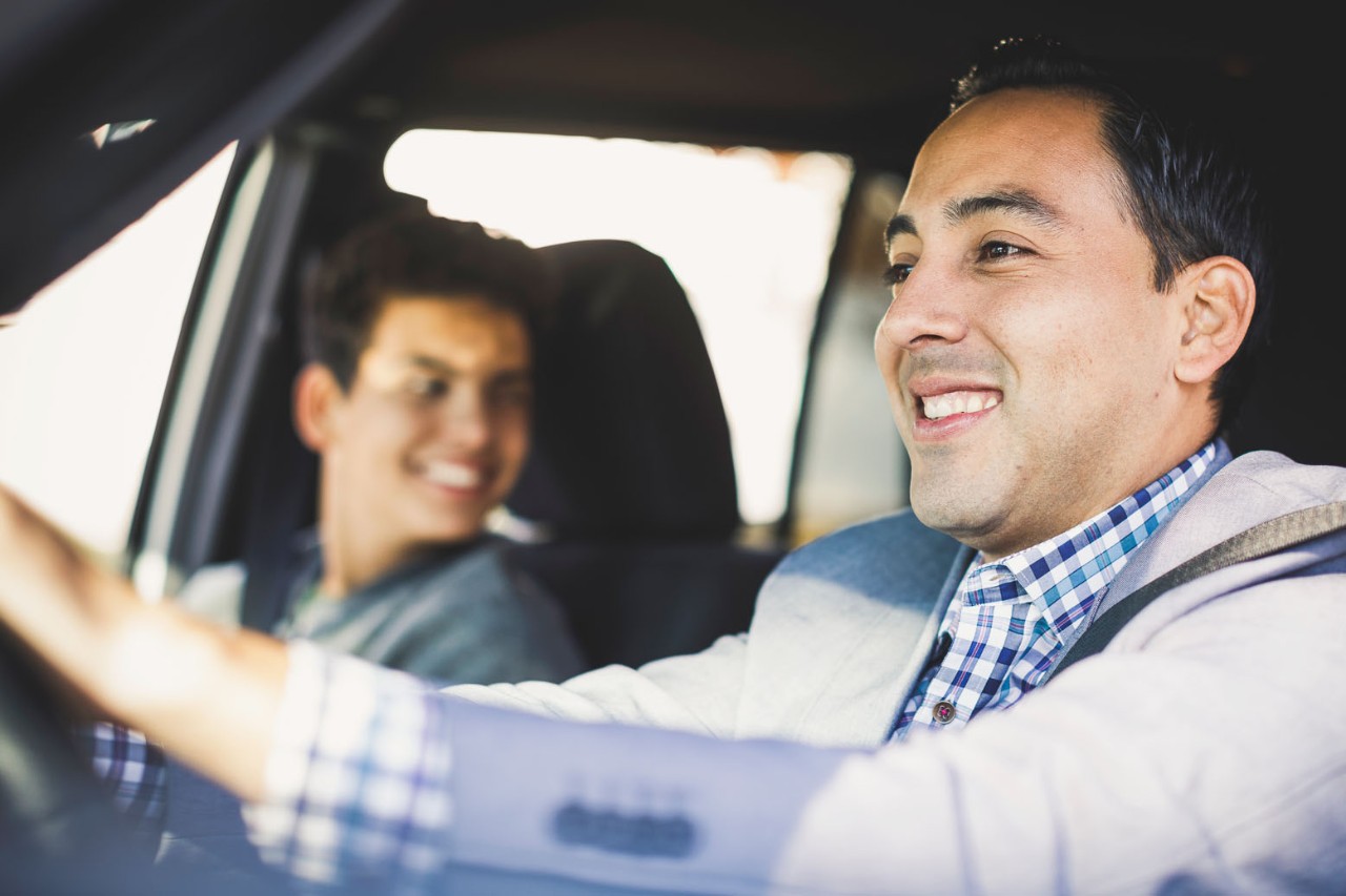 Two men driving car
