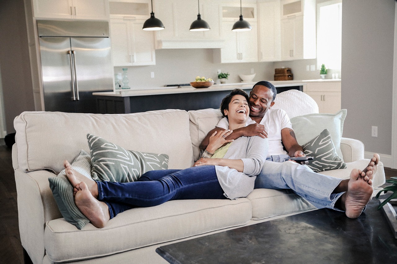 Happy couple on couch