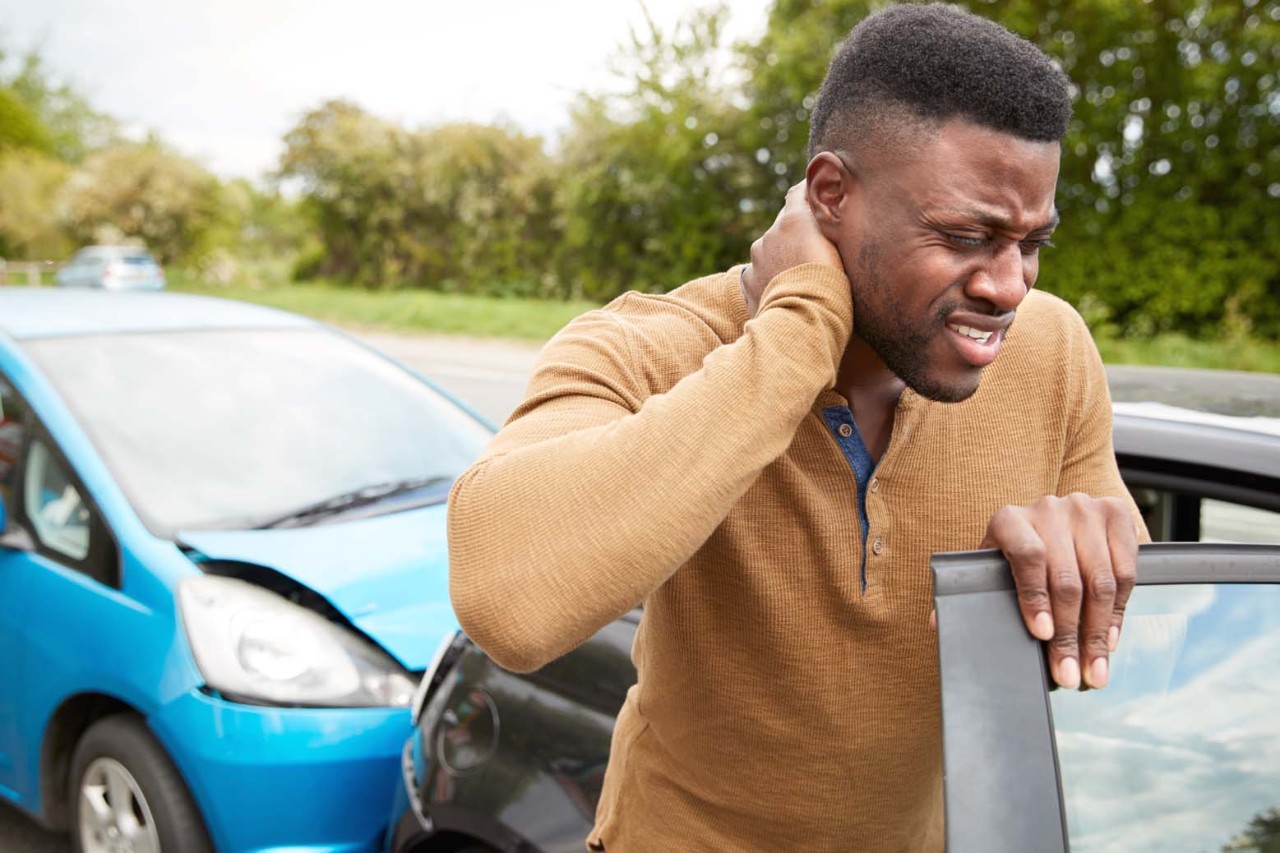 Man with whiplash after car accident.