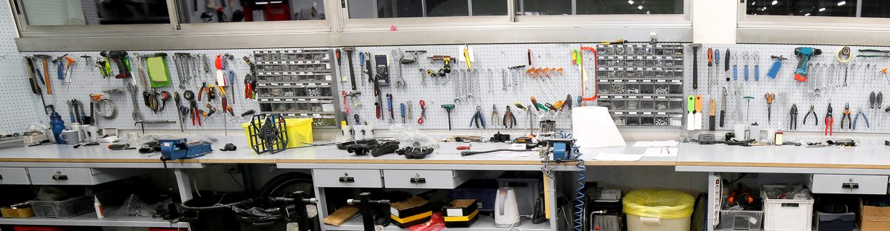 Inside bike shop repair with a bike and tools